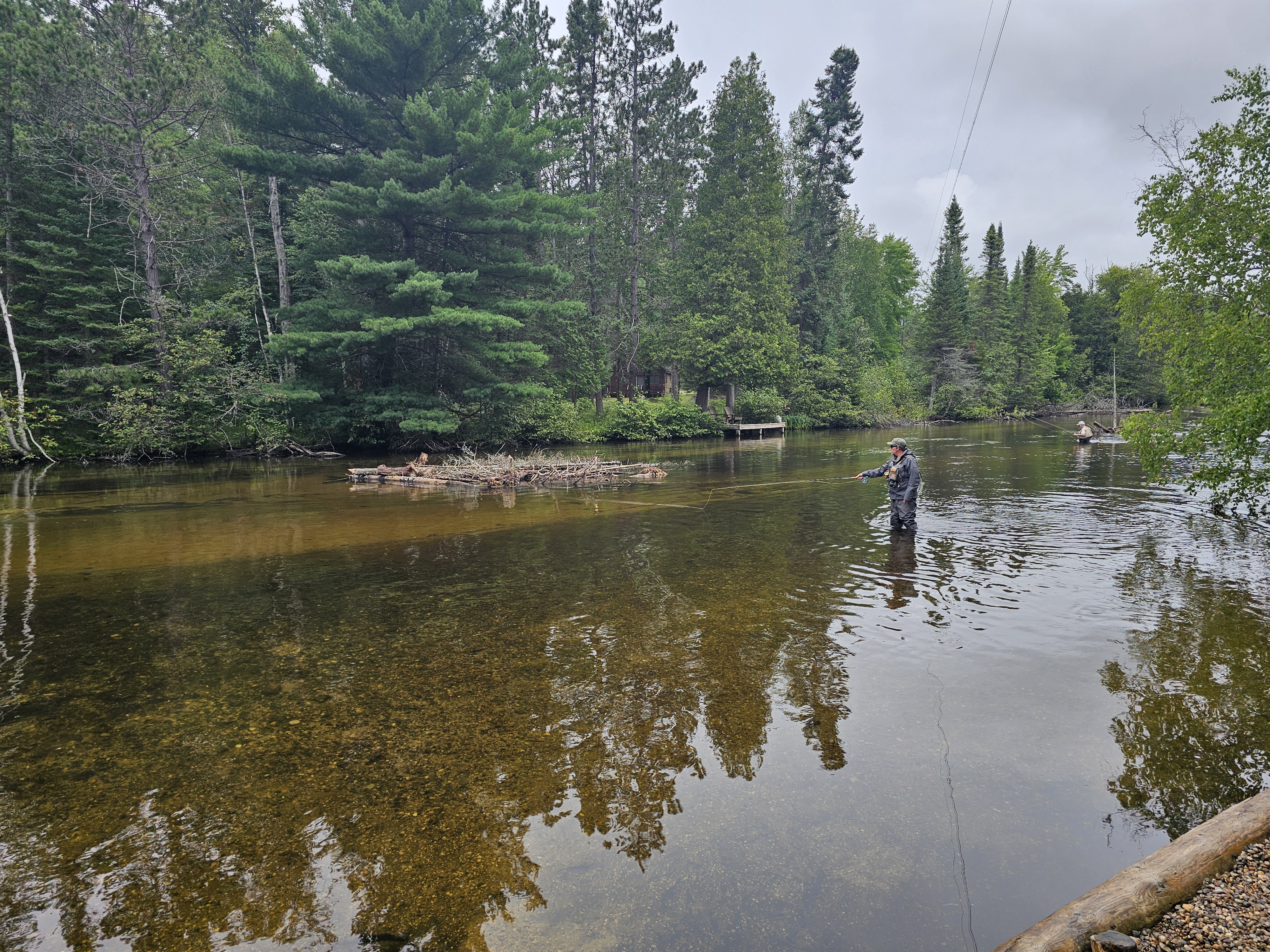 Angler making a cast on the Upper Au Sable River